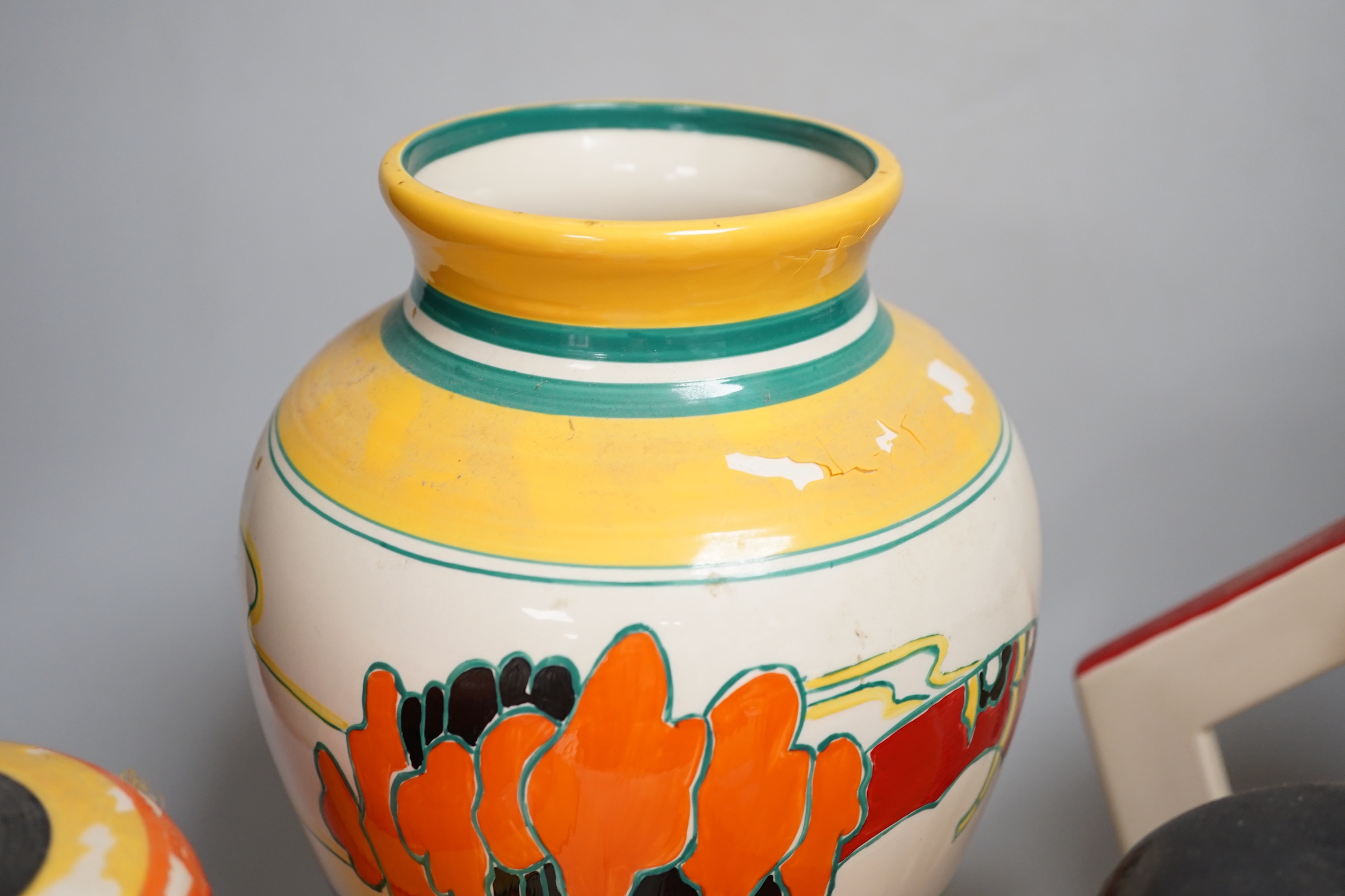 Two Clarice Cliff reproduction Bizarre designed jars, a vase and a jug (decoration a.f.), tallest vase 30cm high